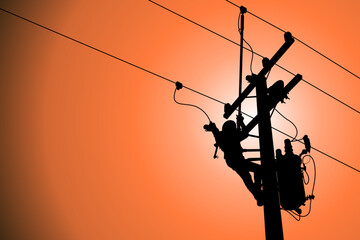 The power lineman use clamp stick (insulated tool) to closing a transformer on energized high-voltage electric power lines. The power lineman must be trained because it is a risky job.