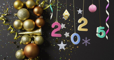 Image of 2025 text and christmas decorations in background