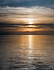 Fototapeta premium Sunset over the calm sea. majestic atmosphere