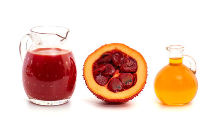 Gac fruits ,oil and extract isolated on white background.