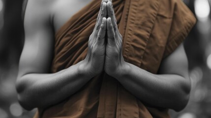 Person praying in brown robe