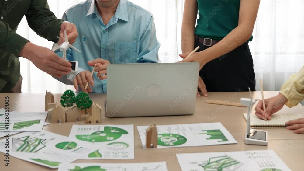 Poster business people consulting use windmill model and house shape block as reference on green energy usa