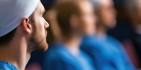 A group of medical professionals attentively listening and discussing critical matters in a healthcare setting, emphasizing collaboration and commitment to patient care.