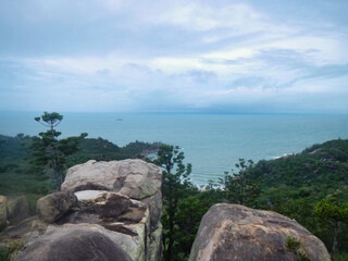 A stunning view of the ocean from a rocky cliff on a cloudy day Magnetic Island Australia