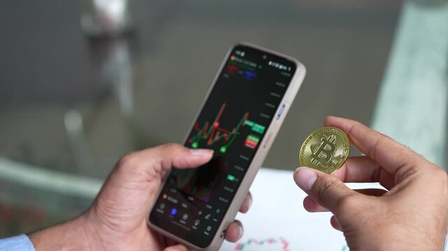 Indian trader trading cryptocurrency bitcoin with smart phone, Rickey investment, Blockchain technology. Digital asset. Scam and anonymous. Finance and economy