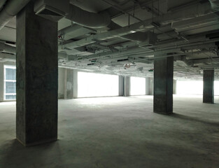 Empty Commercial Space with Concrete Columns and Industrial Interiors. System works.
