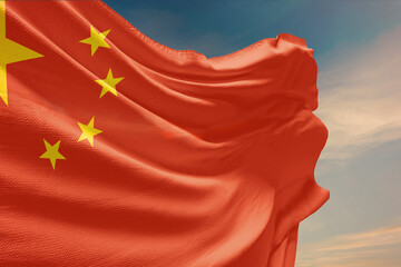 Waving flag of China in blue sky. China flag on pole for Independence Day. The symbol of the state on wavy fabric.