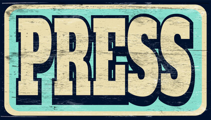 Aged and worn press sign on wood