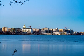Downtown Madison, WI and the Wisconsin State Capitol Building behind Lake Monona at Twilight