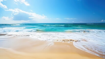 Obraz premium Beautiful Sandy Beach with Soft Blue Ocean Wave, Golden Sand, Gentle Ripple, Ideal Place for Relaxation and Enjoying the Seaside Scenery.