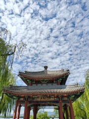 BEIJING, CHINA - 6th September 2024: The Heralding Spring Pavilion in Summer Palace Beijing under cloudy blue sky