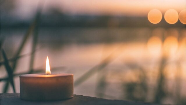 Soul and spirituality abstract concept for mourning and world human spirit day with warm candle light bokeh illumination, golden sunset sky and reflective river wave background
- Powered by Adobe