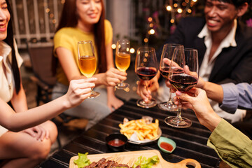 Party Celebrate whiskey at a friendly party in a restaurant. Night.