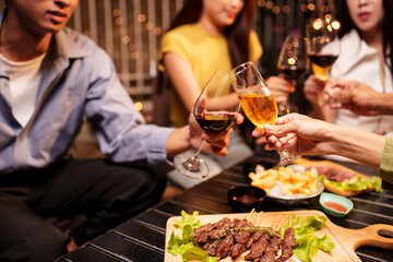 Throw a party Celebrate whiskey at a friendly party in a restaurant. Night.