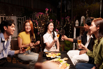 Throw a party Celebrate whiskey at a friendly party in a restaurant. Night.