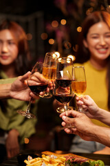 Throw a party Celebrate whiskey at a friendly party in a restaurant. Night.