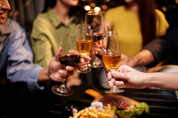 Throw a party Celebrate whiskey at a friendly party in a restaurant. Night.