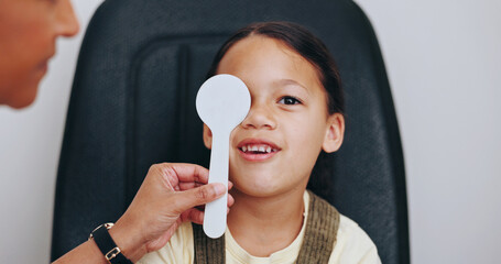 Doctor, occluder or child in eye test at optometry clinic for eyewear, health or sight wellness....