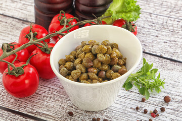 Marinated green capers in the bowl