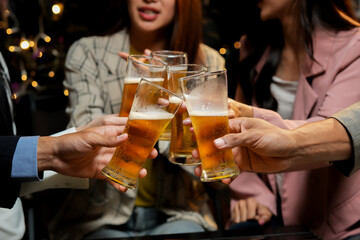 food and drink male friends are happy drinking beer and clinking glasses at a bar or pub.
