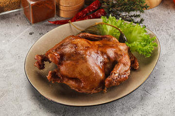Baked small chicken with spices