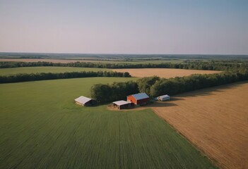 This is an aerial view showcasing a vast farm where cows graze in green grass