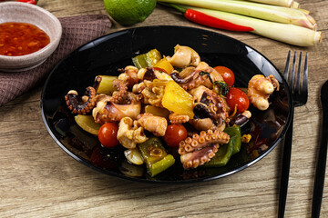 Roasted octopus with vegetables and oil