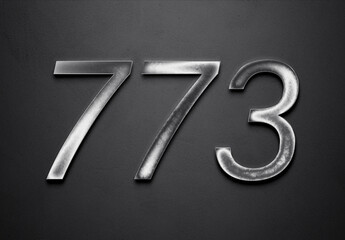 Naklejka premium Chrome metal 3D number design of 773 on grey background.