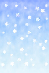 雪の結晶が降る淡く幻想的な背景縦長