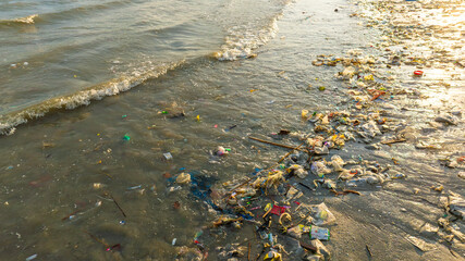 Top view trash, plastic cups and plastic bags at the beach. environmental problem concept and healing the world	
