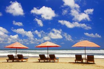 beach with sunbeds and umbrellas