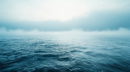 Fototapeta premium Misty Ocean Waves Under a Cloudy Sky