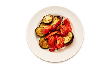 A plate of vegetables including tomatoes and peppers