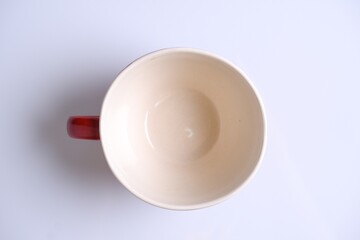 red ceramic mug isolated on white background.Top view 