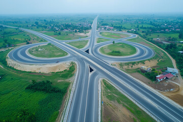 Fototapeta premium highway with a large round curve in the middle. The road is empty and there are no cars on it