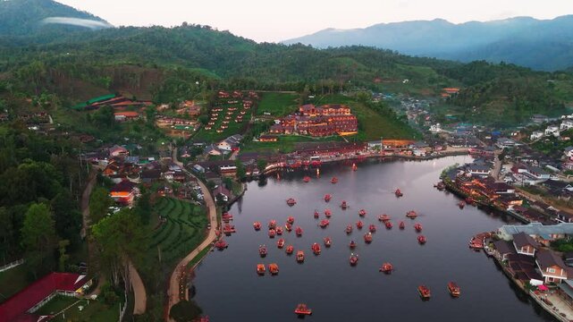 Ban Ran Thai aerial view of Chinese village on Mae Hong Son province in Northern Thailand foggy misty mountains  landscape with traditional boat on the lake 