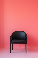 Obraz premium A minimalist black chair sits in the center of an empty room with red walls, creating a striking contrast that highlights its simplicity and elegance.