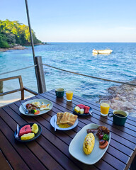 Enjoying a delightful breakfast by the sea on Koh Munnork Island in Thailand