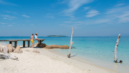 Discovering paradise at Koh Munnork Island in Rayong, Thailand with friends by the shore