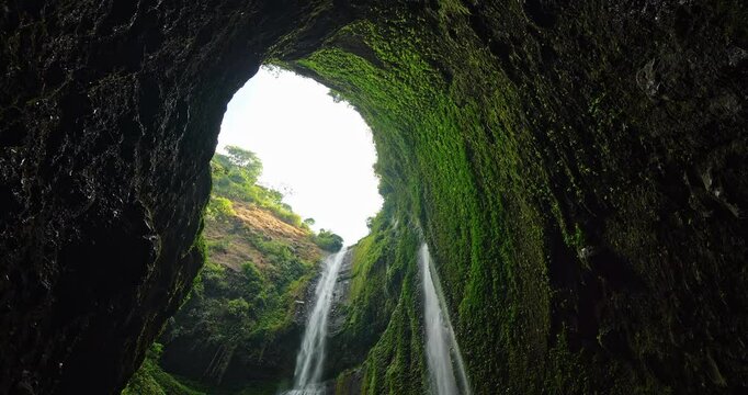 Amazing Beautiful Madakaripura waterfall in tropical rainforest in national park at East Java, Indonesia, Bottom view waterfall landscape for Travel background