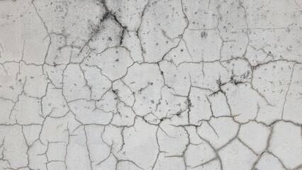 Old gray cement wall texture with black stains, Textured color on cement background. Old concrete wall with cracked flaking paint. The white painted wall surface has scratches and peeling paint.