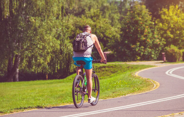Fototapeta premium Cyclist ride on the bike path in the city Park 