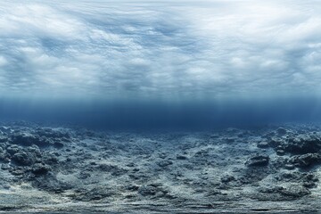 Fototapeta premium Underwater scene with a rocky seabed and cloudy surface.