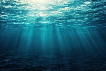 Obraz premium Underwater scene with light rays penetrating the surface.