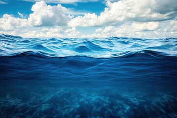 Serene ocean waves under a bright blue sky.