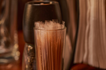 Close-up of a glass with toothpicks on the table. Shallow depth of field.        