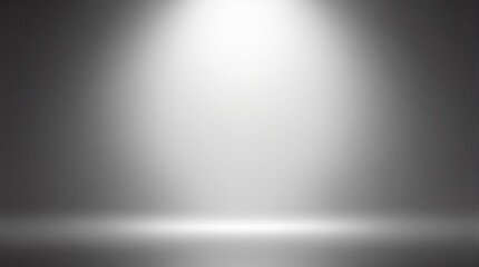 Spotlight on a gradient gray background with illuminated center for highlighting objects.
