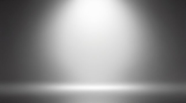 Spotlight on a gradient gray background with illuminated center for highlighting objects.