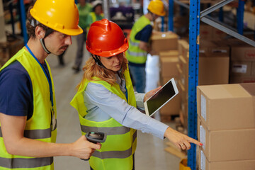 Warehouse workers comparing the list and the packages