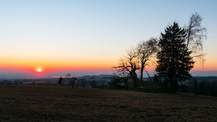 The sun setting over the ruins of World War II fortifications.